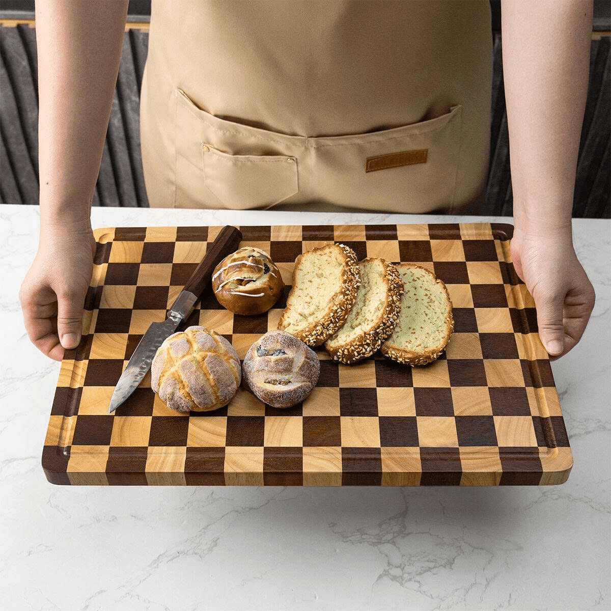 Top view of a rectangular acacia and rubberwood checkerboard cutting and serving board