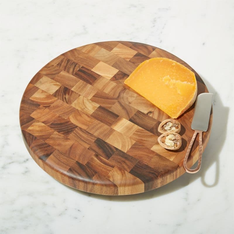 Round acacia end-grain cutting board with visible cross-cut blocks