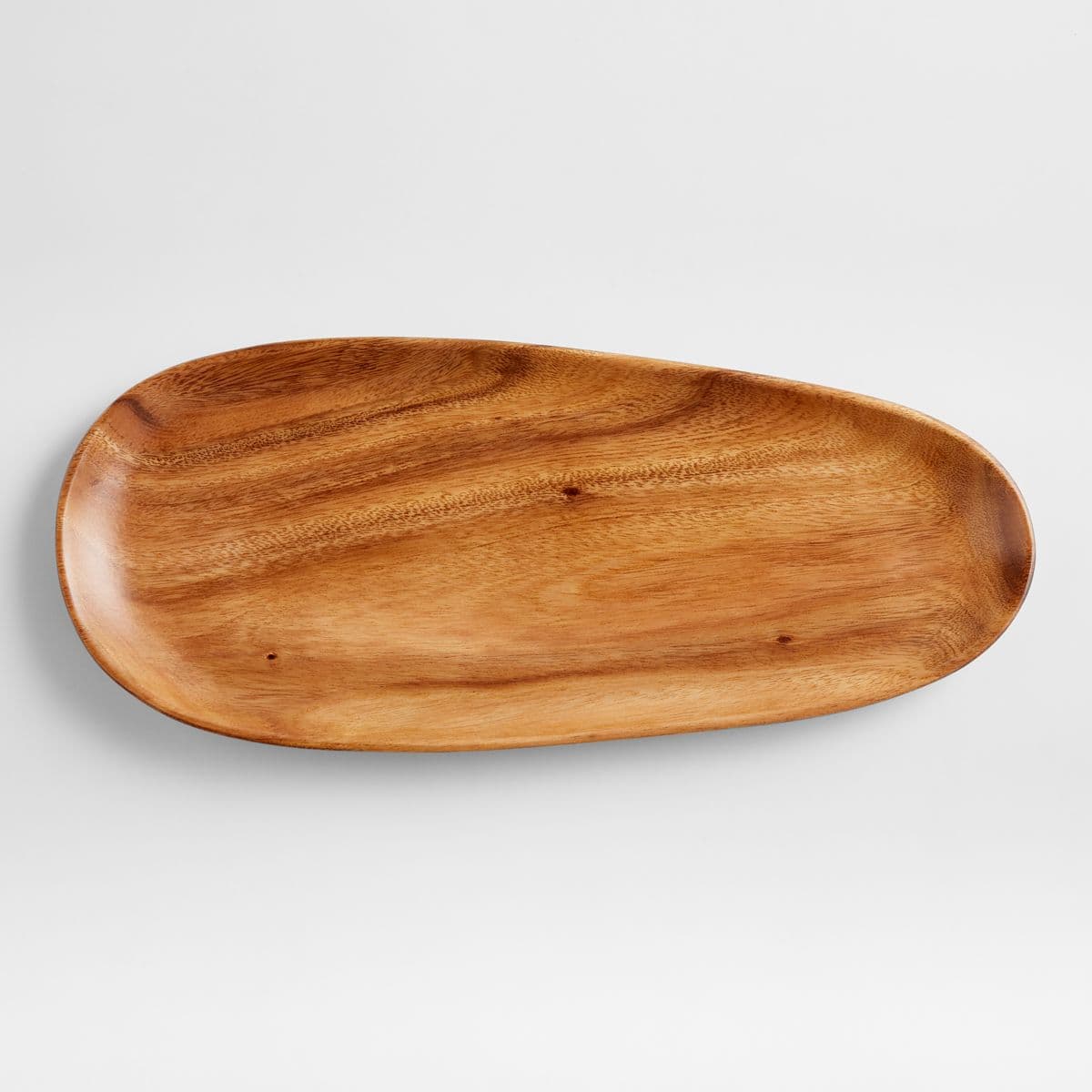 Oval acacia serving platter with a shallow recessed centre and raised edge